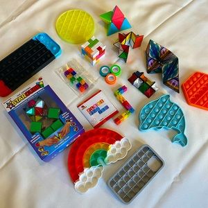 Set of puzzle games, rubiks puzzles, and pop-it fidgets